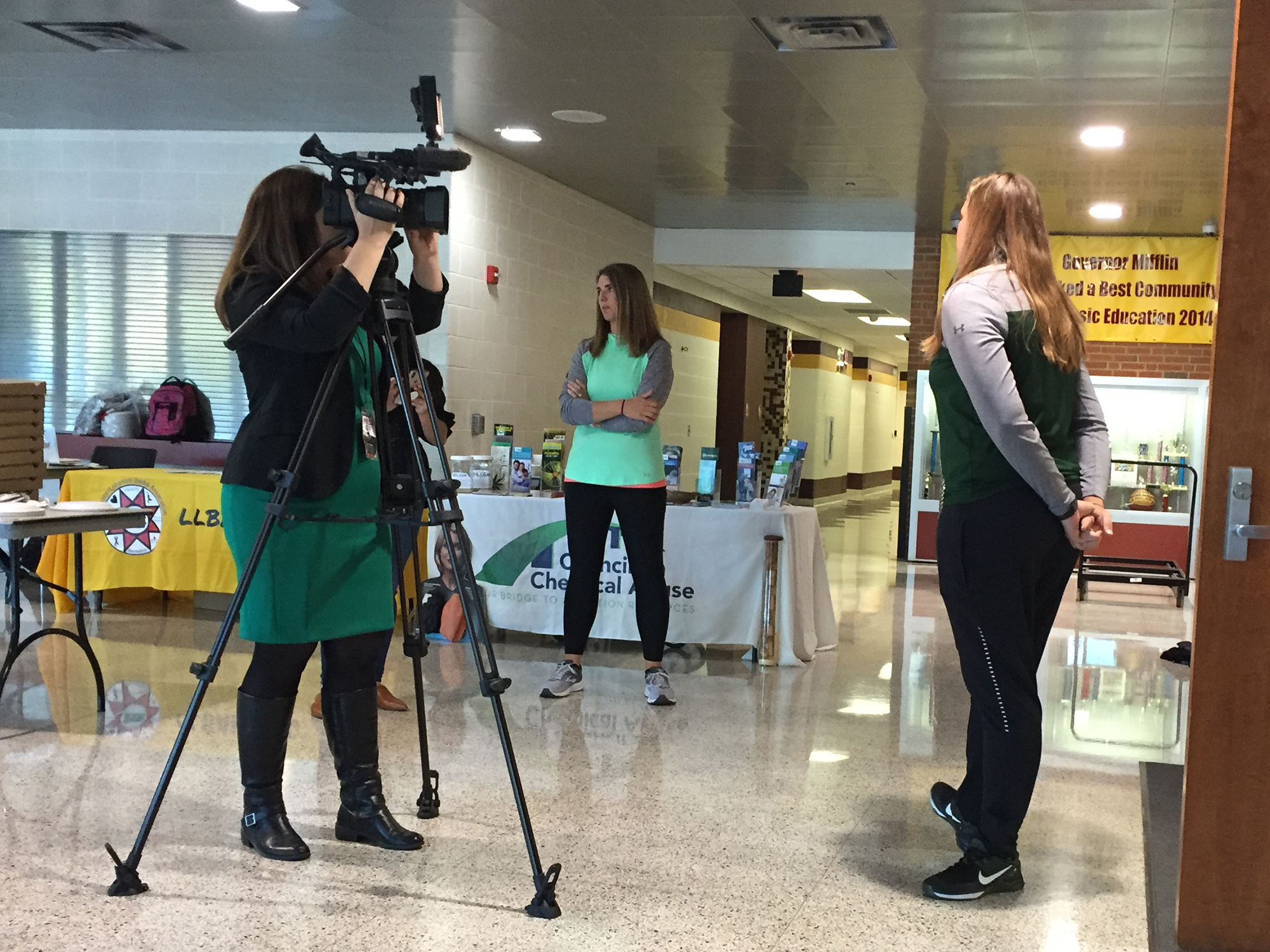 A PBS39 reporter interviewing a teacher at the health and physical education inservice session