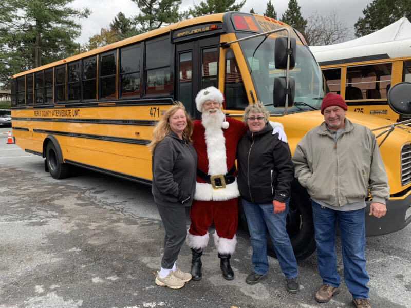 BCIU Transportation employees, Erica Wolf and Stephanie Mullarkey, with Santa and retired BCIU employee, Jake Bechtel, at People First. BCIU provided transportation for the event.