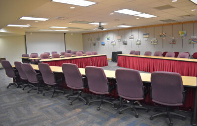 A wide shot of the BCIU Board Room including student art hanging on the walls