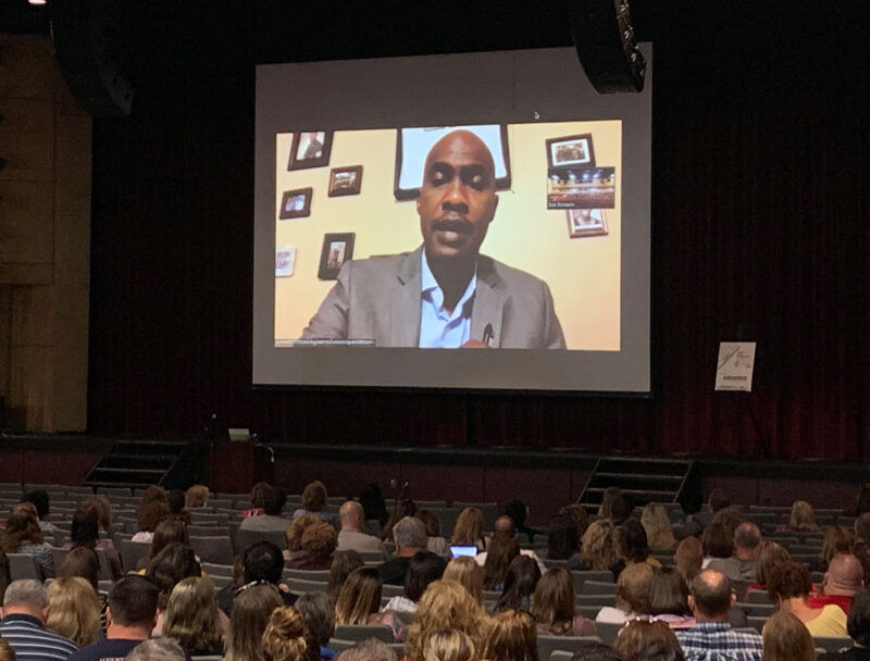Dr. Tyrone C. Howard delivers the virtual keynote presentation on the big screen at the Core Connections Conference 2019